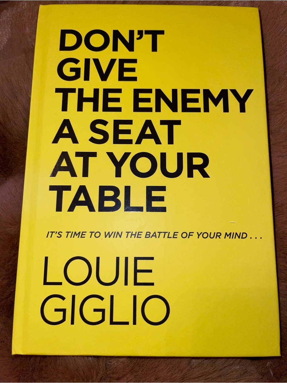 'Don't Give the Enemy a Seat at Your Table' - Yellow Hardcover
